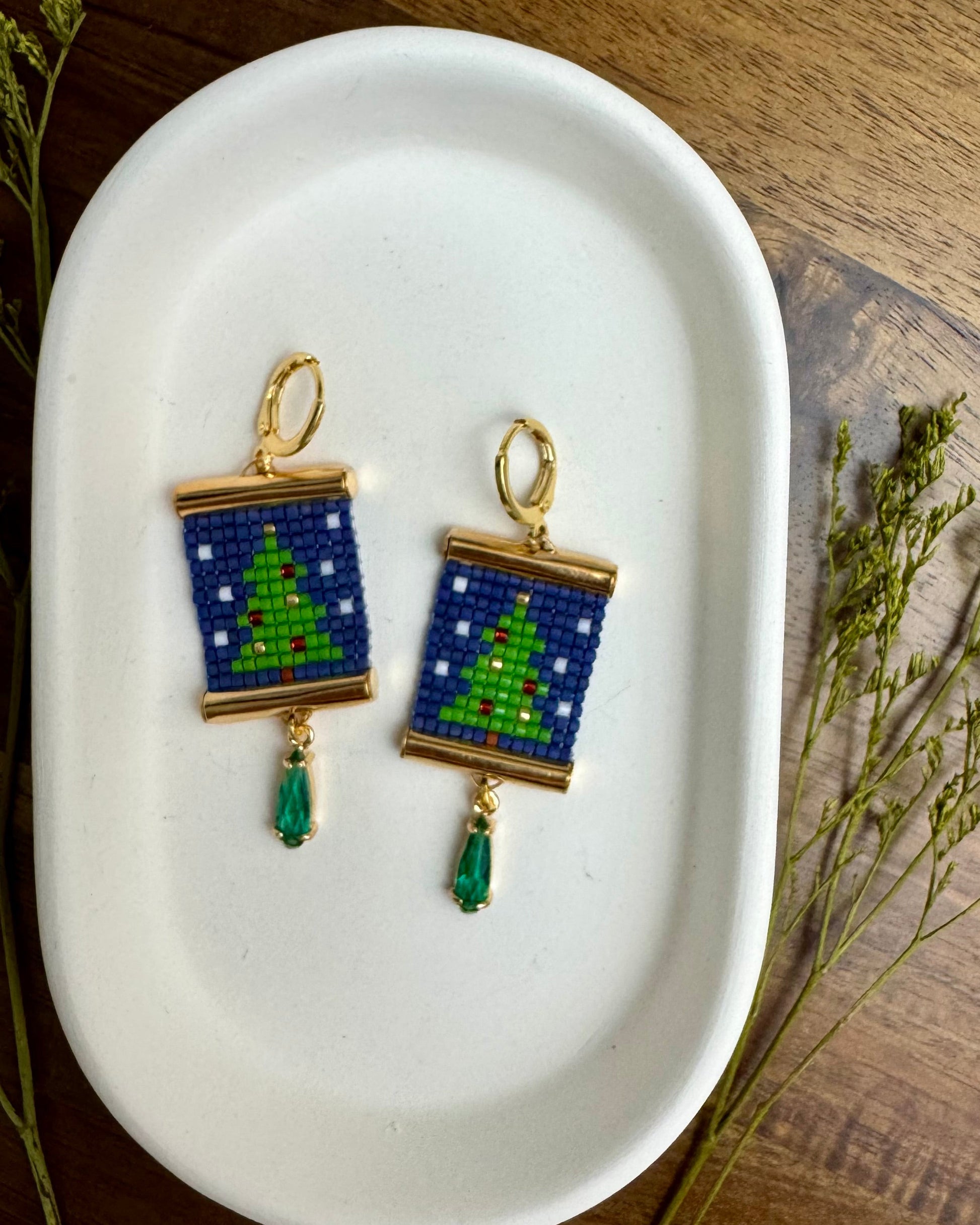 Beaded earrings depicting Christmas trees.