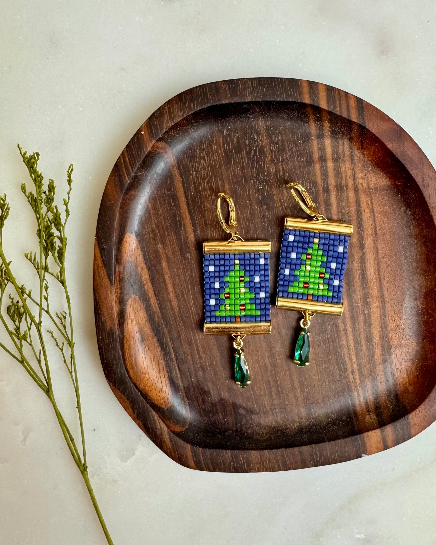Christmas Tree Earrings on Wooden Coaster