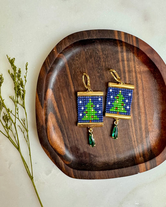 Christmas Tree Earrings on Wooden Coaster